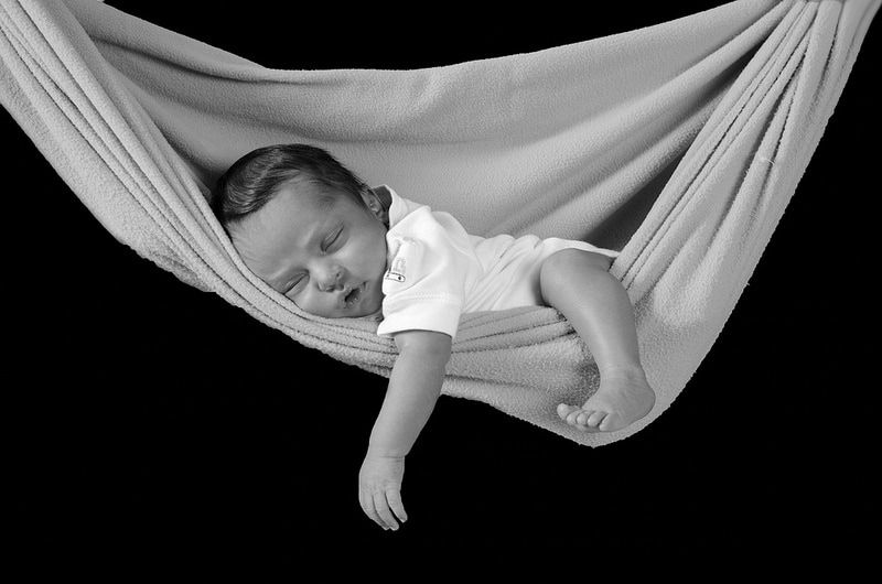mount olive birth doula mount olive birth class image of sleeping baby in a sling or hammock