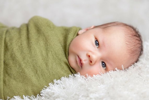 picture of baby wrappen in blanket, eyes wide open, facing camera, morristown childbirth classes, morristown birth class, morristown childbirth class, morristown natural birth class